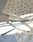 pastel cherry print baby layette