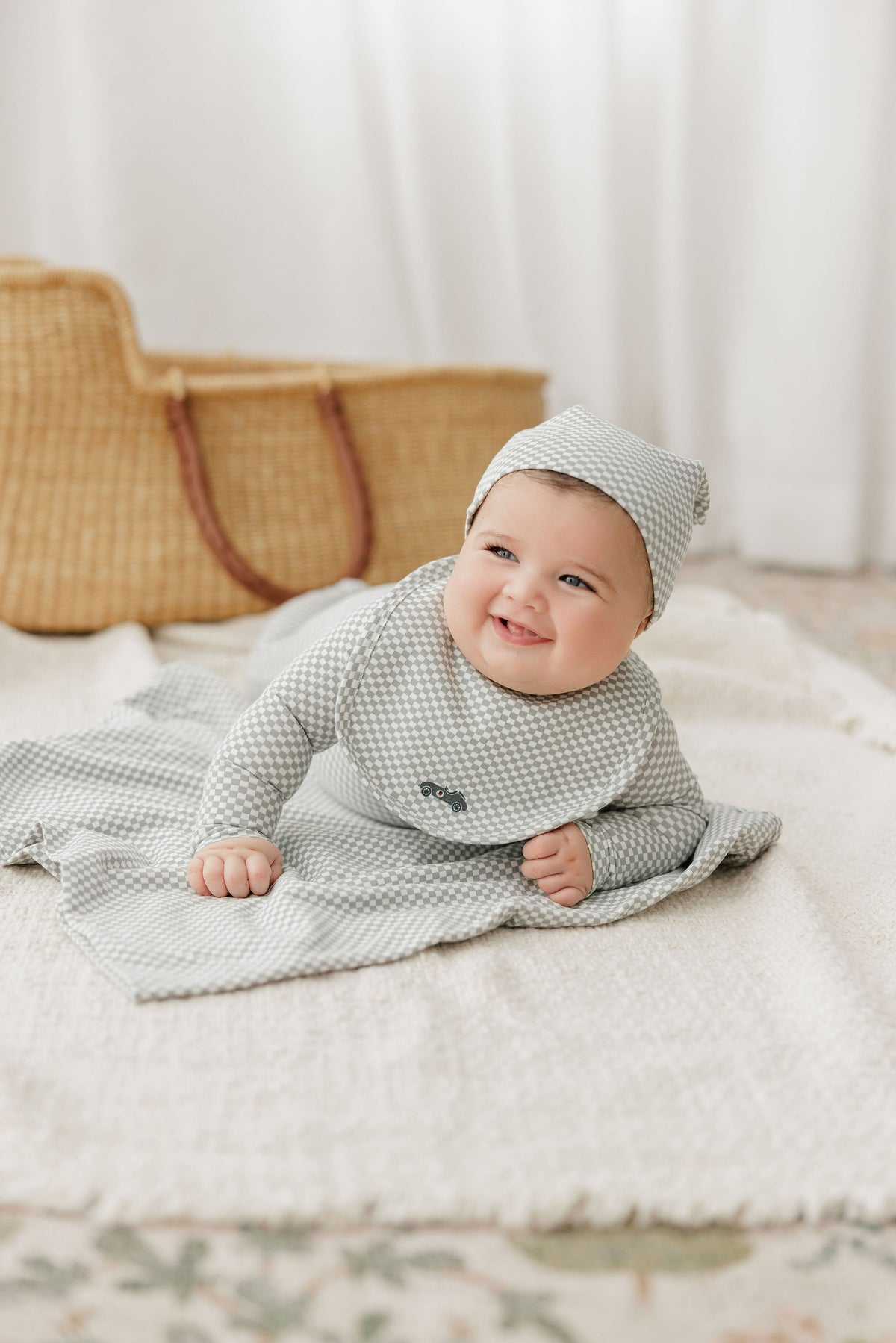 Newborn baby dressed in a cozy hospital take me home outfit